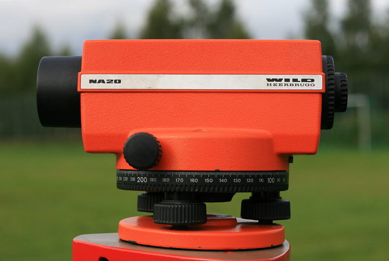 Wild NA20 optical survey level mounted on a tripod in the field