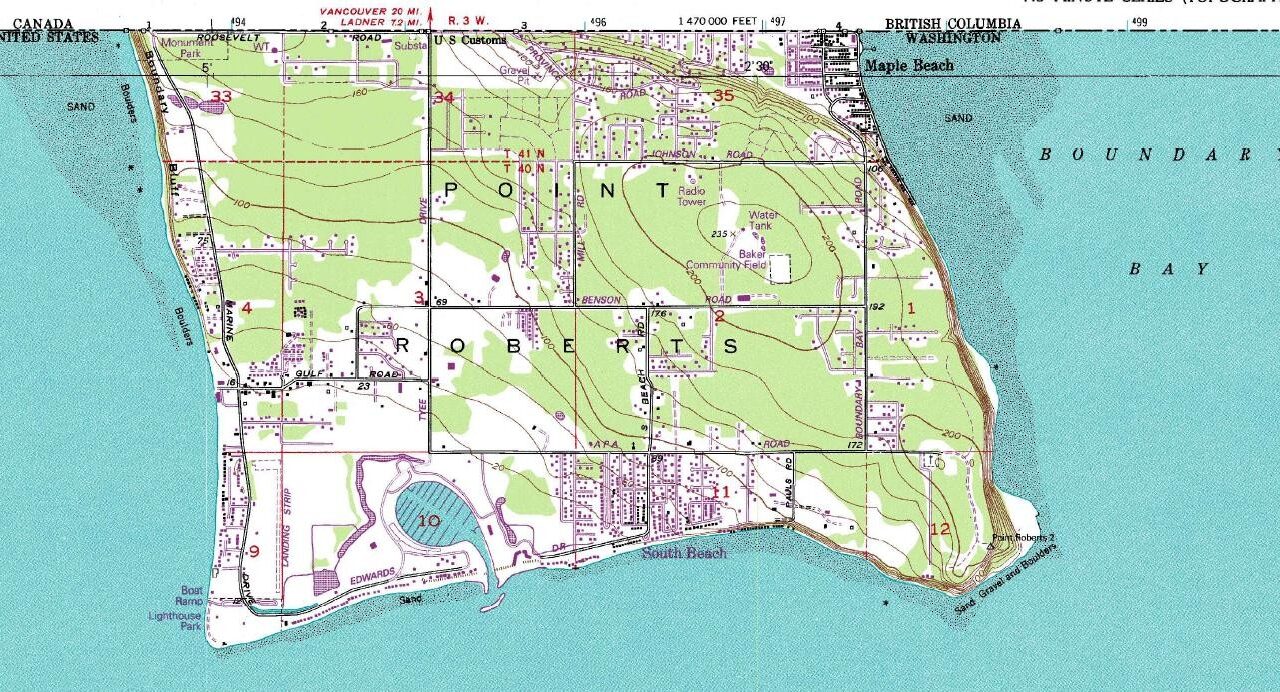 USGS topographic map showing Point Roberts south of the Canadian boundary, with shorelines, contours, roads, and Boundary Bay.