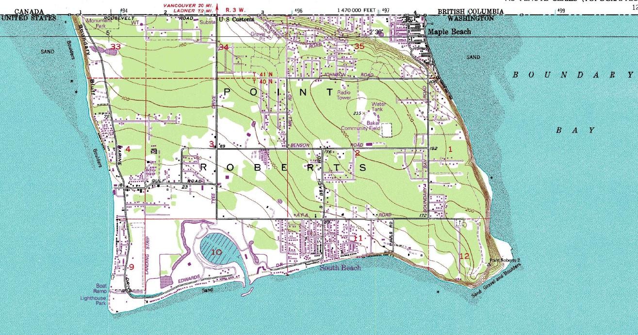 USGS topographic map showing Point Roberts south of the Canadian boundary, with shorelines, contours, roads, and Boundary Bay.