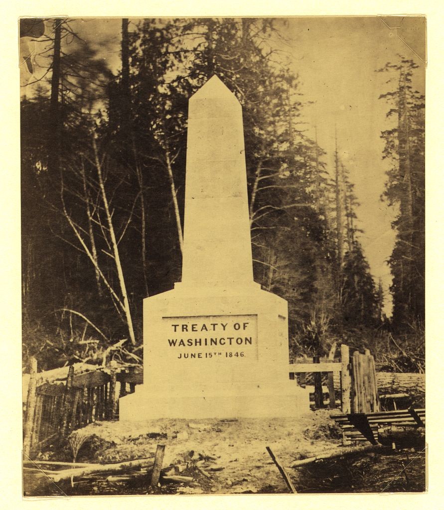 Historic photograph of the Point Roberts boundary monument with an inscription for the June 15, 1846 treaty.