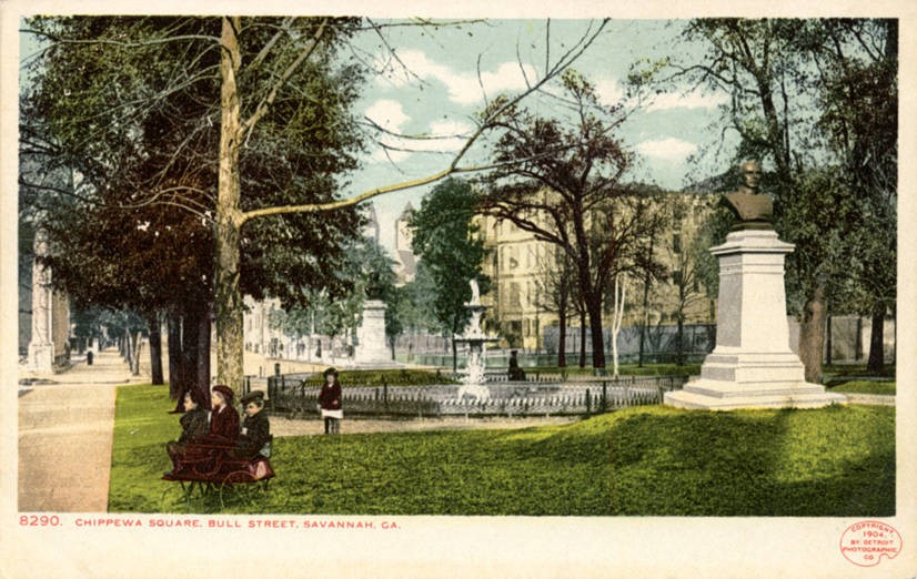 Color postcard of Chippewa Square in 1904, with people near a bench, mature trees, a fountain, and a monument.